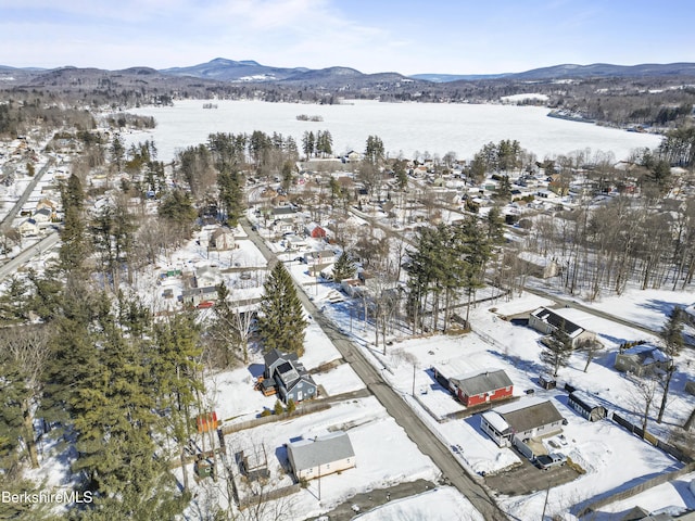 snowy aerial view featuring a mountain view