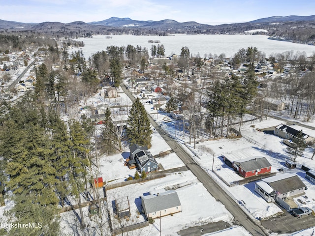 snowy aerial view featuring a mountain view