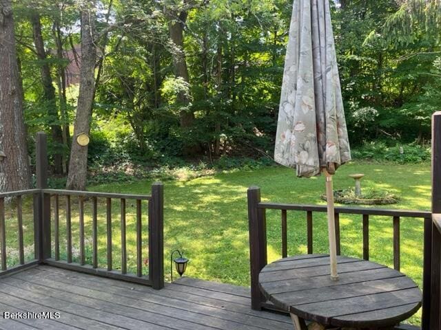 wooden deck with a yard