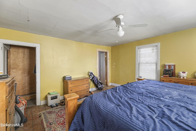 bedroom with light hardwood / wood-style flooring and ceiling fan