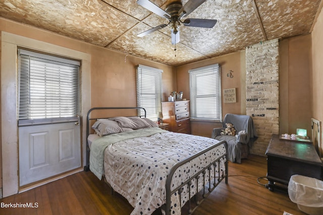 bedroom featuring dark wood-type flooring and ceiling fan