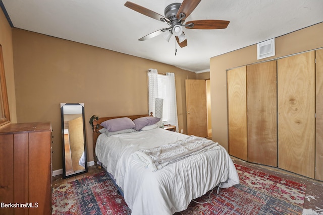 bedroom featuring ceiling fan and a closet