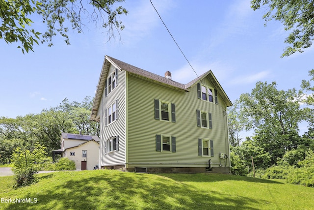 26 Crosier Ave, Pittsfield, MA 01201 - view of property exterior featuring a yard and a chimney
