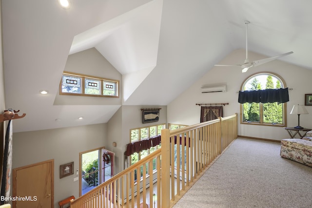 83 Hancock Rd, Pittsfield, MA 01201 - corridor featuring an upstairs landing, high vaulted ceiling, carpet floors, a wall unit AC, and recessed lighting