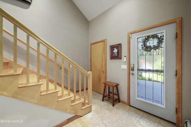 83 Hancock Rd, Pittsfield, MA 01201 - entrance foyer with stairway, high vaulted ceiling, and a baseboard heating unit