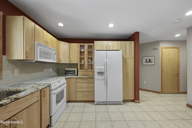 83 Hancock Rd, Pittsfield, MA 01201 - kitchen with white appliances, light stone countertops, backsplash, glass insert cabinets, and light brown cabinetry