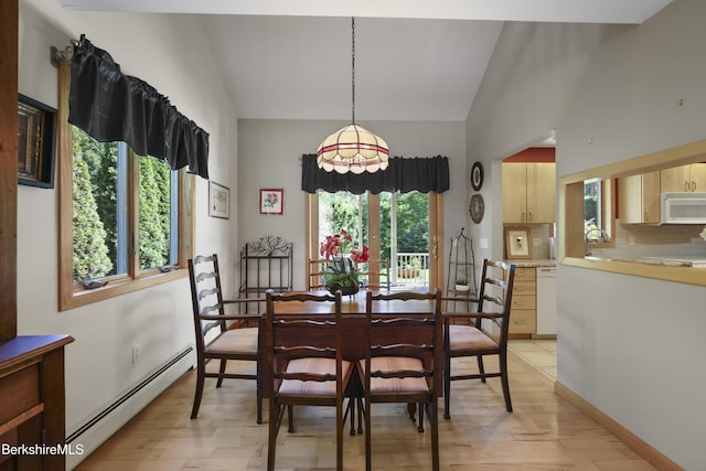 83 Hancock Rd, Pittsfield, MA 01201 - dining space with a baseboard heating unit, lofted ceiling, and light wood-type flooring