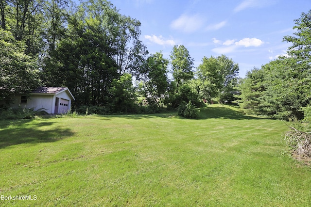 83 Hancock Rd, Pittsfield, MA 01201 - view of green lawn with a garage
