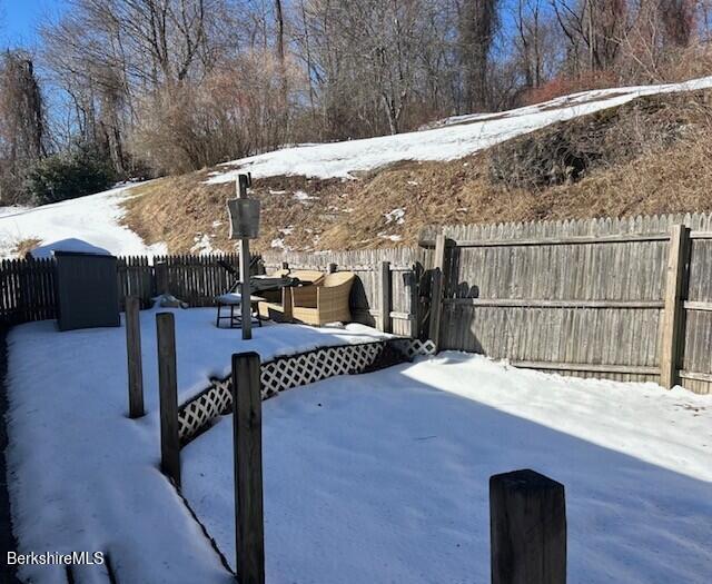 view of yard layered in snow