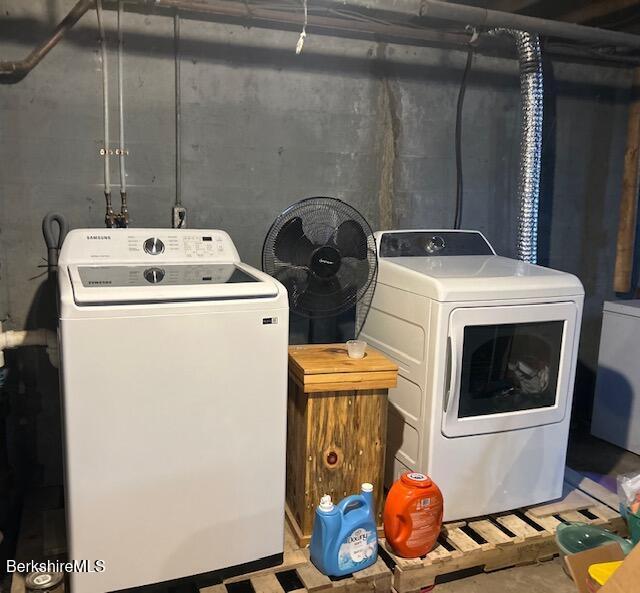 laundry area with independent washer and dryer