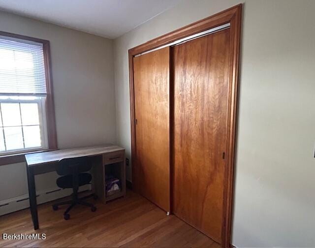 unfurnished office with light hardwood / wood-style floors