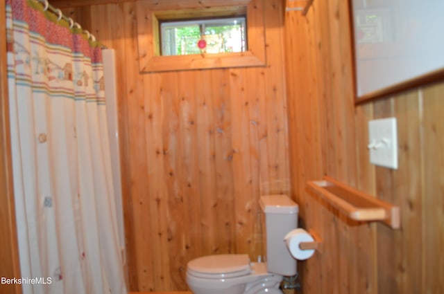 113 Iroquois Ave, Becket, MA 01223 - bathroom with wood walls and a shower with curtain