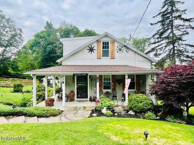 60 Summer St, Lanesborough, MA 01237 - country-style home featuring a porch and a front yard