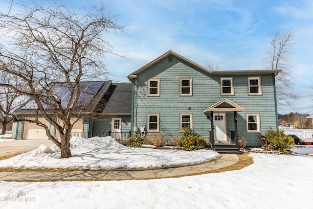 view of front of home featuring an attached garage and driveway