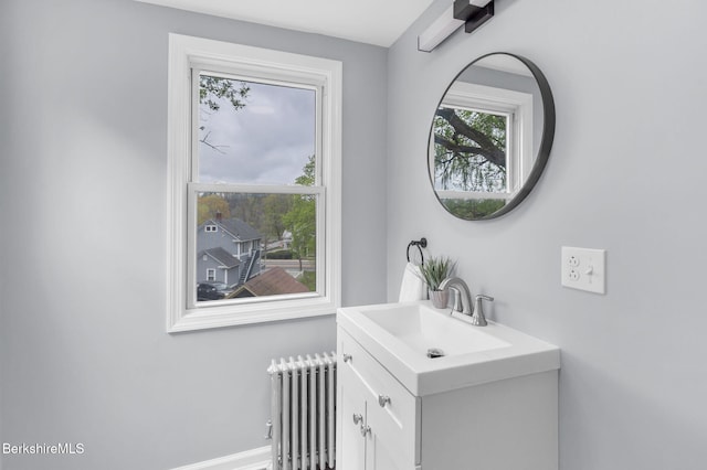 90 Maple St, Lee, MA 01238 - bathroom featuring radiator heating unit, vanity, and baseboards