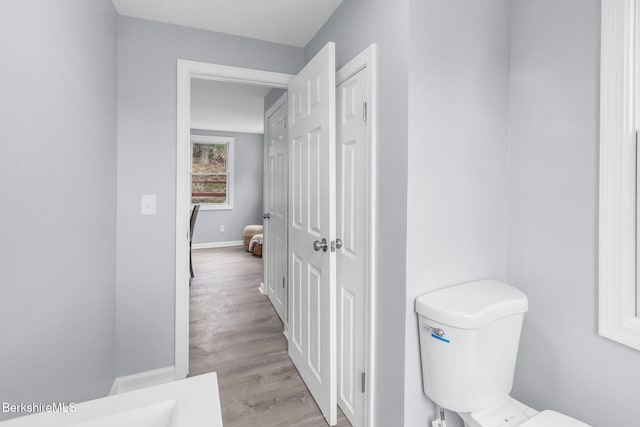 90 Maple St, Lee, MA 01238 - bathroom with wood finished floors, baseboards, and toilet