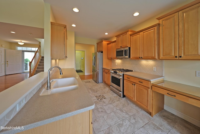 33 Alpine Trl, Pittsfield, MA 01201 - kitchen with stainless steel appliances, a sink, decorative backsplash, recessed lighting, and light countertops