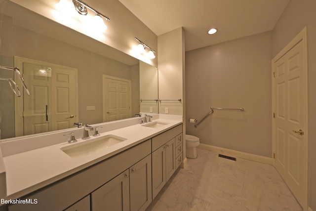 33 Alpine Trl, Pittsfield, MA 01201 - bathroom featuring double vanity, toilet, marble look tiles, recessed lighting, and baseboards