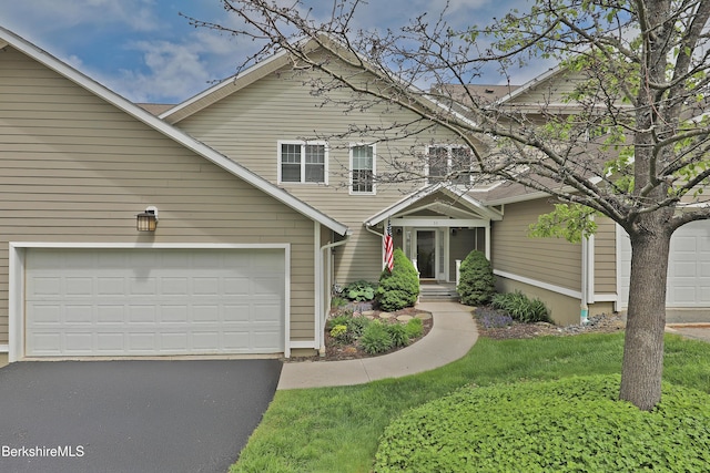 33 Alpine Trl, Pittsfield, MA 01201 - traditional-style home featuring asphalt driveway, a front lawn, and an attached garage