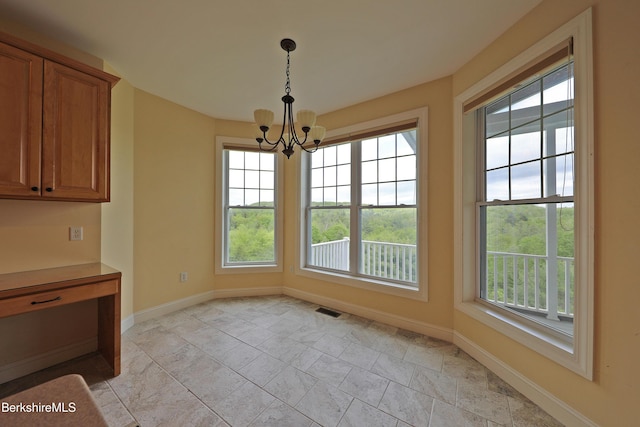 33 Alpine Trl, Pittsfield, MA 01201 - unfurnished dining area with a chandelier and baseboards