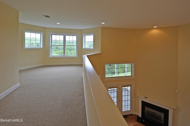 33 Alpine Trl, Pittsfield, MA 01201 - staircase featuring baseboards, a fireplace with flush hearth, recessed lighting, and carpet floors