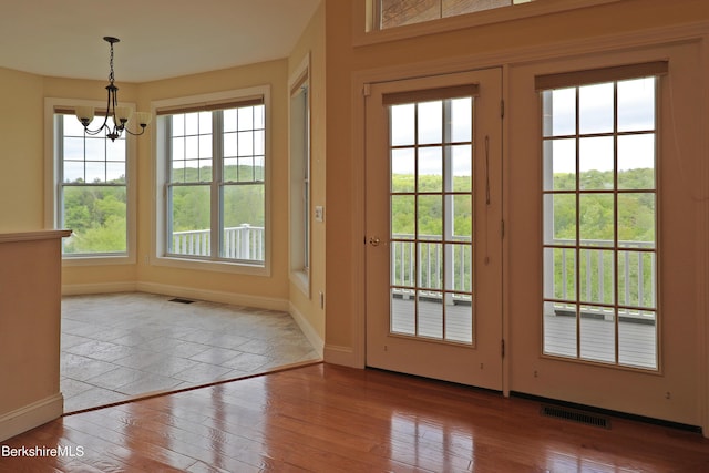 33 Alpine Trl, Pittsfield, MA 01201 - doorway to outside with baseboards, hardwood / wood-style floors, a chandelier, and healthy amount of natural light