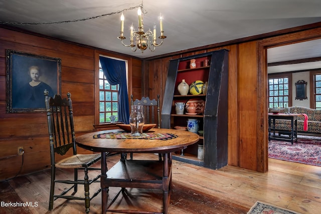 196 S St, Williamstown, MA 01267 - dining room featuring a chandelier, hardwood / wood-style flooring, healthy amount of natural light, and wooden walls