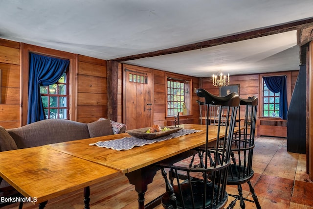 196 S St, Williamstown, MA 01267 - dining space featuring a chandelier, radiator heating unit, hardwood / wood-style floors, wood walls, and beam ceiling