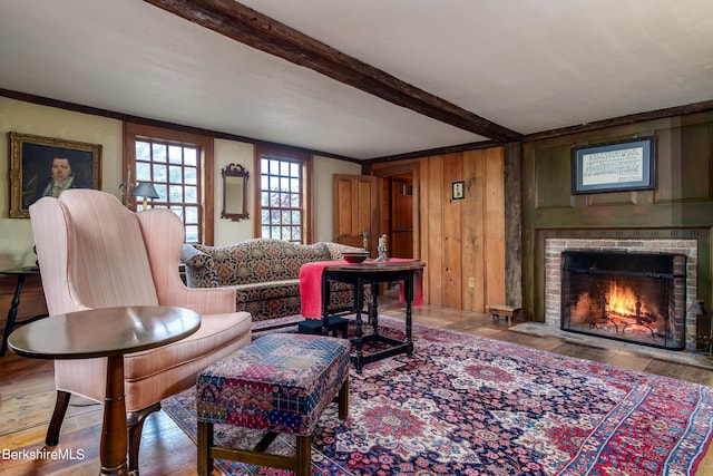 196 S St, Williamstown, MA 01267 - living area featuring beam ceiling, a fireplace, wood finished floors, and wooden walls