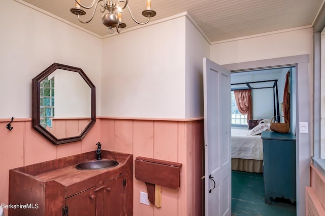 196 S St, Williamstown, MA 01267 - bathroom featuring a wainscoted wall, vanity, crown molding, a chandelier, and connected bathroom