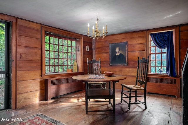 196 S St, Williamstown, MA 01267 - dining room featuring radiator, a chandelier, plenty of natural light, and wooden walls