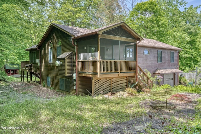 477 Greylock St, Lee, MA 01238 - view of front of home featuring stairway, a sunroom, a garage, and a shingled roof