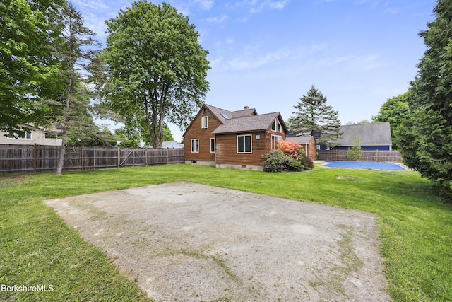 back of house featuring a chimney and a patio