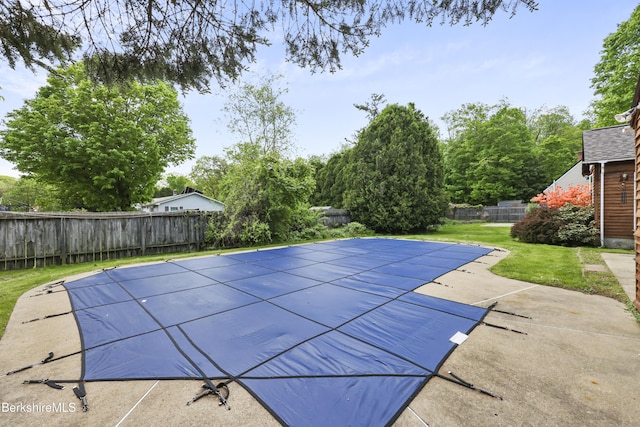 view of swimming pool featuring a patio