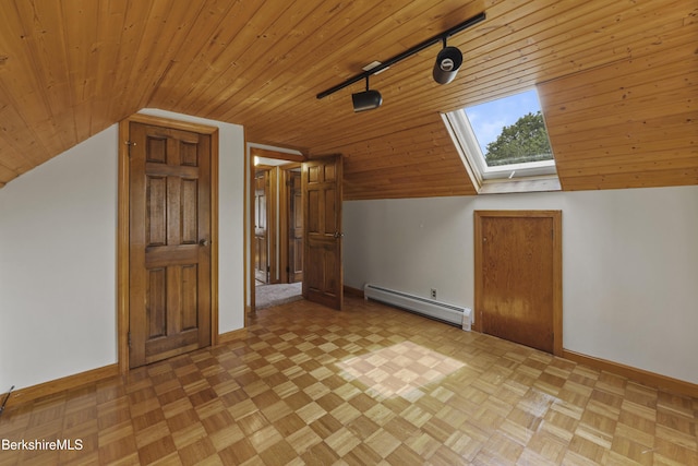 bonus room with a baseboard radiator, vaulted ceiling, a skylight, wood ceiling, and baseboards