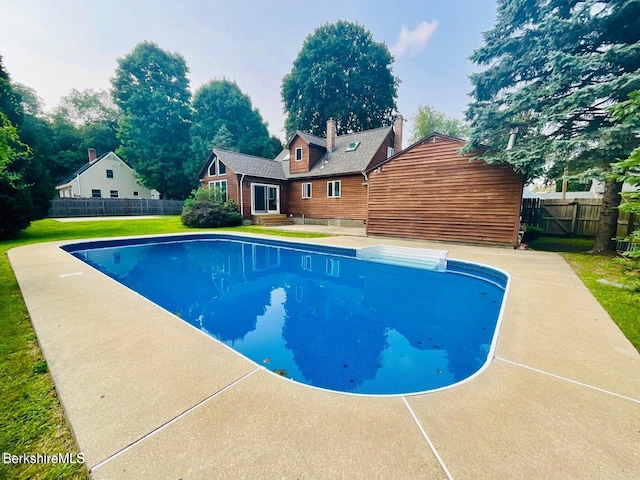 view of swimming pool with a patio area