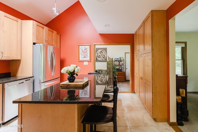 126 Christian Hill Rd, Great Barrington, MA 01230 - kitchen featuring white dishwasher, freestanding refrigerator, a kitchen island, a kitchen bar, and dark stone countertops