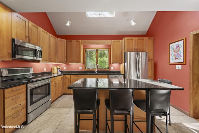 126 Christian Hill Rd, Great Barrington, MA 01230 - kitchen with stainless steel appliances, vaulted ceiling, a breakfast bar area, a kitchen island, and light tile patterned flooring