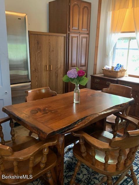 dining area with wood walls