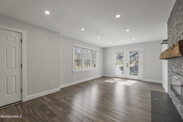 404 N St, Williamstown, MA 01267 - unfurnished living room with french doors, a fireplace, recessed lighting, dark wood-style flooring, and baseboards