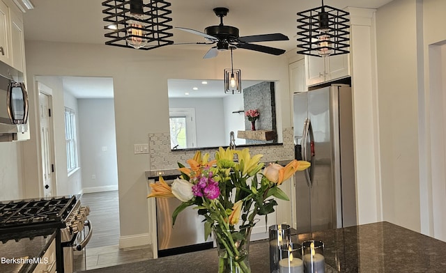 404 N St, Williamstown, MA 01267 - kitchen featuring stainless steel appliances, tasteful backsplash, white cabinets, baseboards, and a ceiling fan
