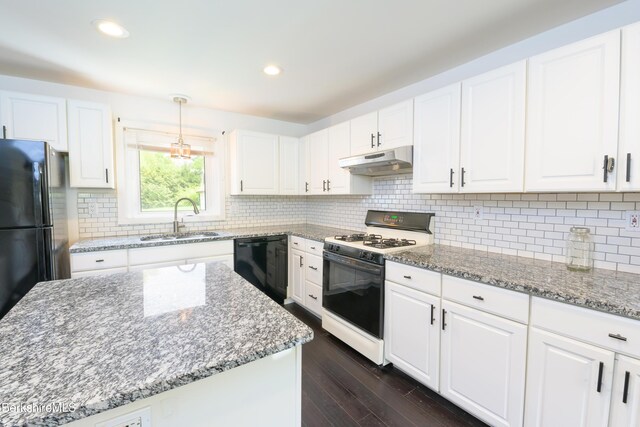 800 Simonds Rd, Williamstown, MA 01267 - kitchen with white gas range oven, a sink, black dishwasher, under cabinet range hood, and dark wood-style flooring