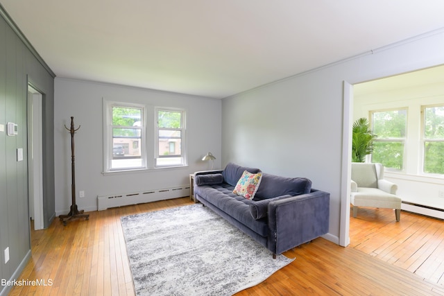 800 Simonds Rd, Williamstown, MA 01267 - living area with baseboard heating, light wood-type flooring, ornamental molding, and a baseboard heating unit