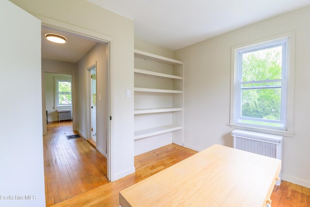 800 Simonds Rd, Williamstown, MA 01267 - unfurnished office featuring radiator heating unit, light wood finished floors, baseboards, and built in shelves