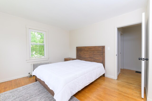 800 Simonds Rd, Williamstown, MA 01267 - bedroom with radiator, light wood-style flooring, and baseboards