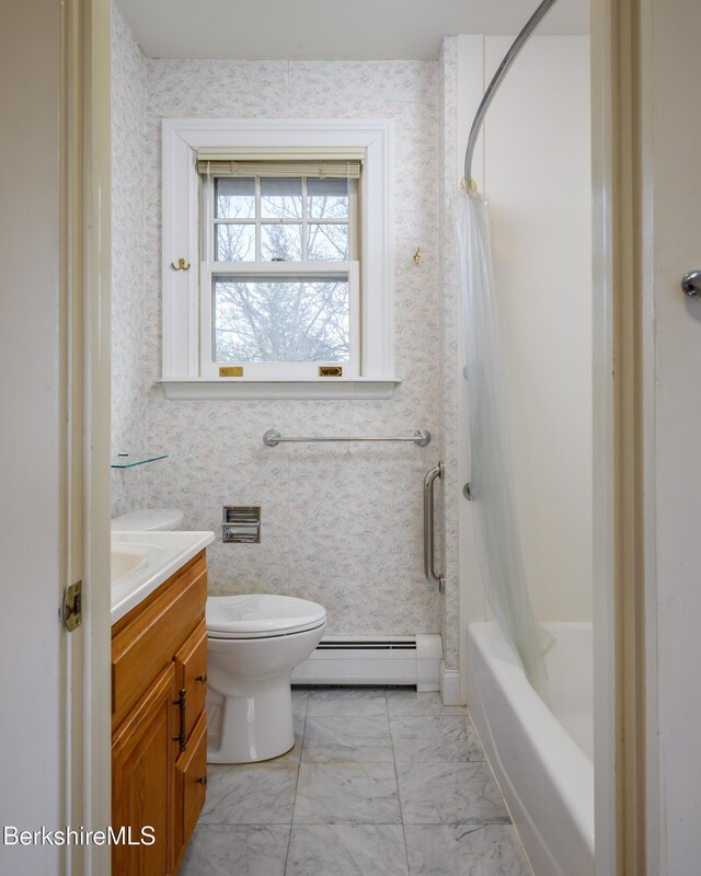 bathroom with wallpapered walls, toilet, baseboard heating, marble finish floor, and vanity