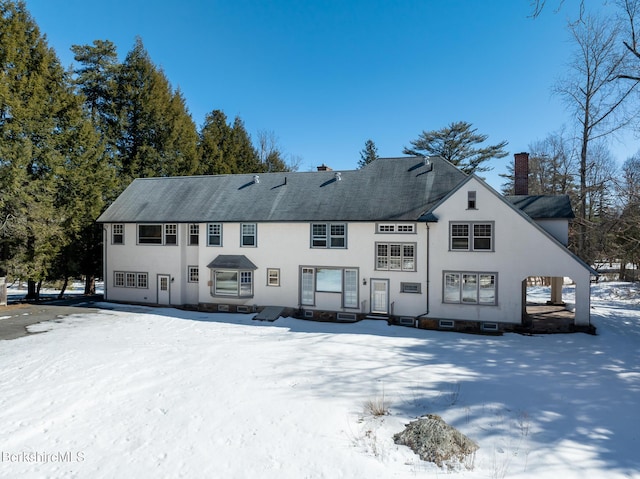 view of snow covered house