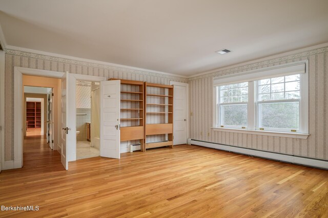 unfurnished bedroom with wallpapered walls, light wood finished floors, baseboard heating, and ornamental molding