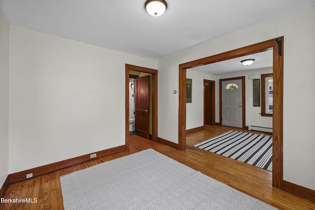 41 Pine St, Dalton, MA 01226 - empty room with a baseboard radiator, baseboards, and wood finished floors