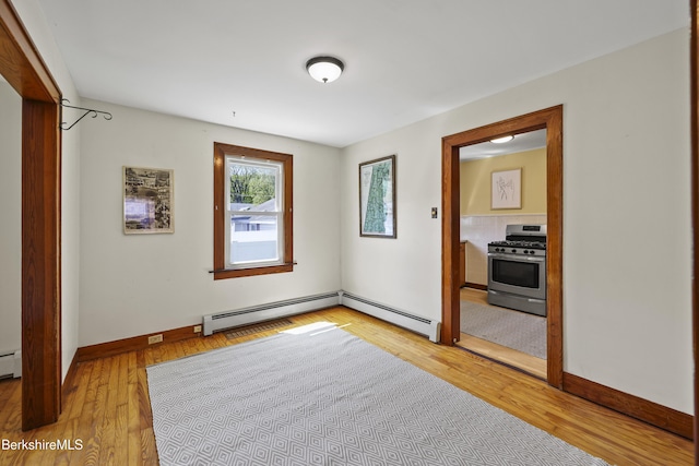 41 Pine St, Dalton, MA 01226 - unfurnished room featuring baseboard heating, light wood-type flooring, and baseboards